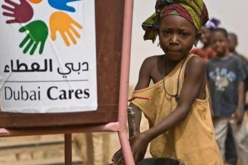 Aissata TelyCooks, an 8-year-old child in Mali washes her hands with soap the Dubai Cares installed next to school latrines.