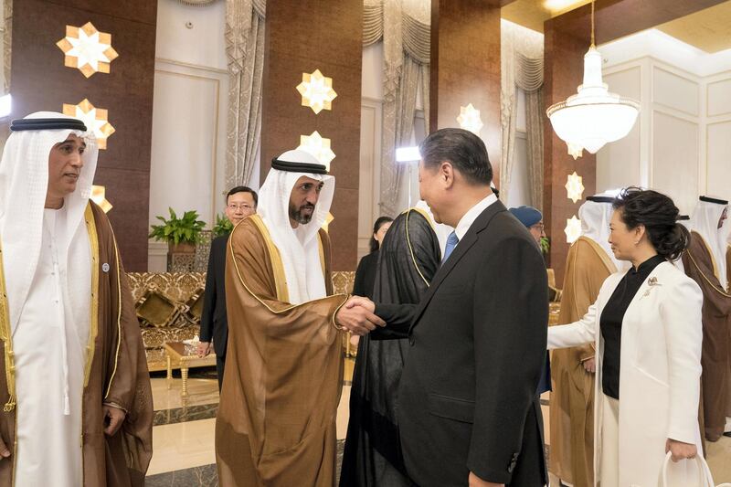 ABU DHABI, UNITED ARAB EMIRATES - July 19, 2018: HE Mohamed Mubarak Al Mazrouei, Undersecretary of the Crown Prince Court of Abu Dhabi (2nd L) greets HE Xi Jinping, President of China (3rd L), during a reception held at the Presidential Airport. Seen with HE Jaber Al Suwaidi, General Director of the Crown Prince Court - Abu Dhabi (L), and Peng Liyuan, First Lady of China (R).

( Mohamed Al Hammadi / Crown Prince Court - Abu Dhabi )
---