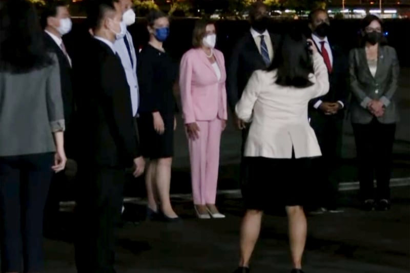 Ms Pelosi poses with members of her delegation and Taiwanese officials. AP