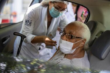 Maria de Nazare, who turns 100 on May 21, receives the CoronaVac vaccine at a vaccination station at the Rio de Janeiro State University (UERJ) on February 1, 2021. Getty Images