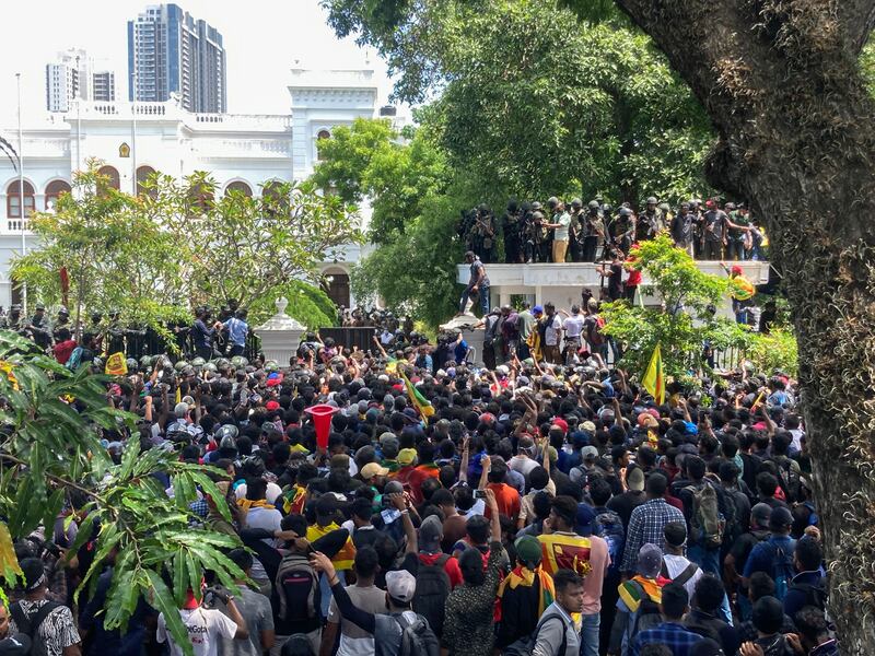 Protesters storm Prime Minister Ranil Wickremesinghe's office in Colombo, Sri Lanka and demand his resignation, after President Gotabaya Rajapaksa fled the economic and political crisis for the Maldives. AP