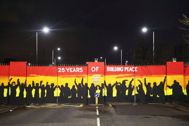 A mural commemorating 25 years since the Good Friday Agreement in Belfast. AP