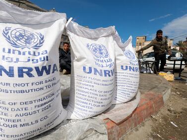 Displaced Palestinians wait to receive United Nations Relief and Works Agency (UNRWA) aid. Reuters/file