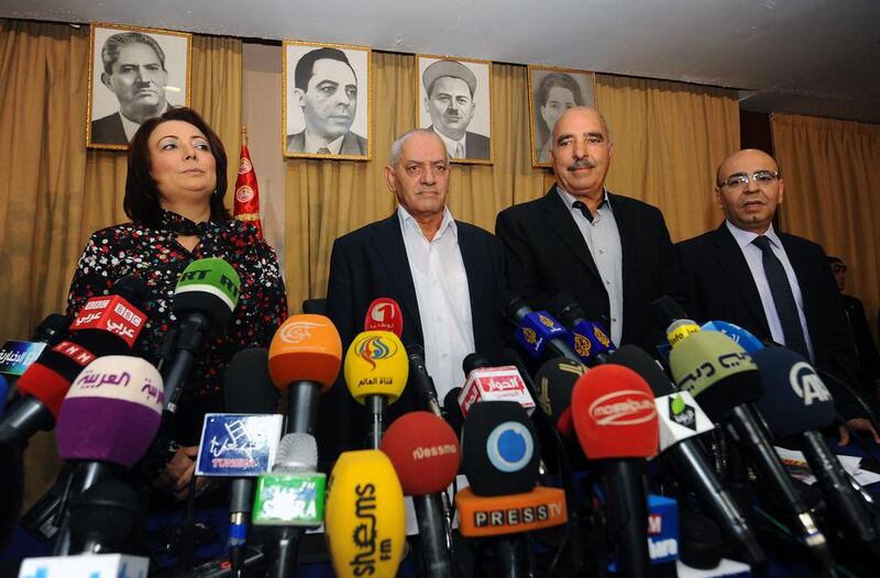 From left, Wided Bouchamaoui, Houcine Abbassi, Abdessattar ben Moussa and Mohammed Fadhel Mahmoud, leaders of the four groups comprising the Tunisian National Dialogue Quartet, which was yesterday honoured when the Nobel committee awarded the coalition with its annual peace prize. Fethi Belaid / AFP



