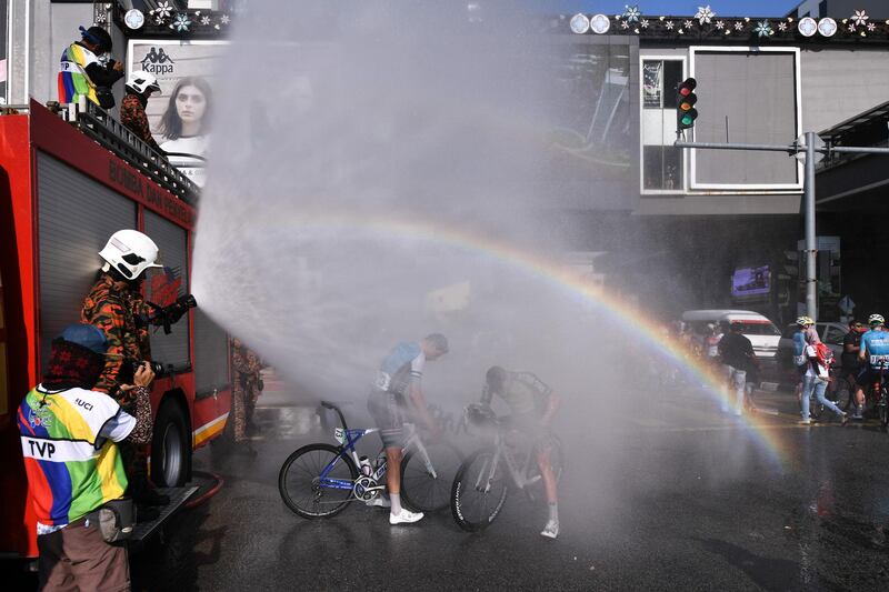 Cyclists are sprayed with water after finishing Stage 2 of the 24th Le Tour de Langkawi  in Melaka, Malaysia. Getty Images