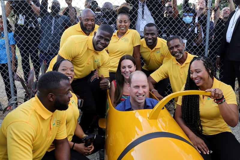 Prince William and Catherine, the Duchess of Cambridge, meet Jamaica's National bobsleigh team in Trench Town, Jamaica, on day four of the Platinum Jubilee Royal Tour of the Caribbean. Reuters