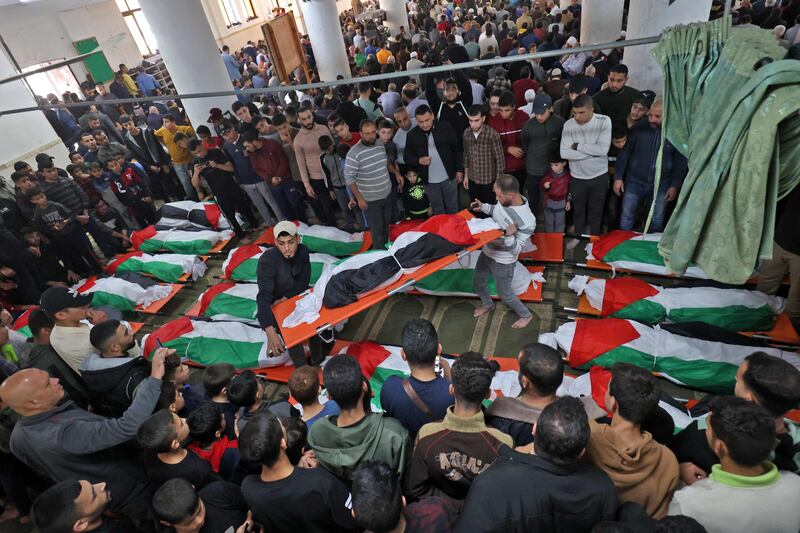 Mourners attend the funeral. AFP