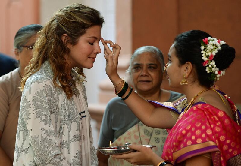 Mrs Trudeau is welcomed on her arrival at the Sophia College for Women for the interactive session in Mumbai. Punit Paranjpe / AFP Photo