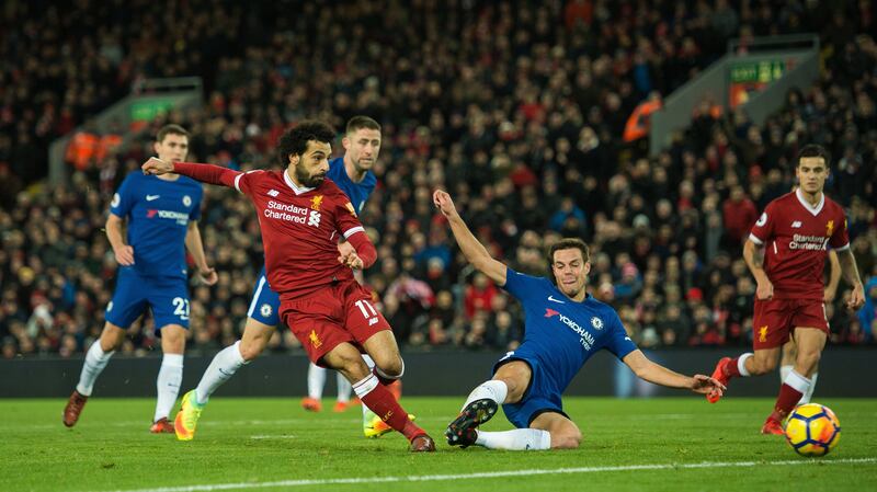 epa06350928 Liverpool’s Mohamed Salah (L) scores the opening goal during the English Premier League soccer match between Liverpool and Chelsea held at the Anfield, in Liverpool, Britain, 25 November 2017.  EPA/PETER POWELL EDITORIAL USE ONLY. No use with unauthorized audio, video, data, fixture lists, club/league logos or 'live' services. Online in-match use limited to 75 images, no video emulation. No use in betting, games or single club/league/player publications