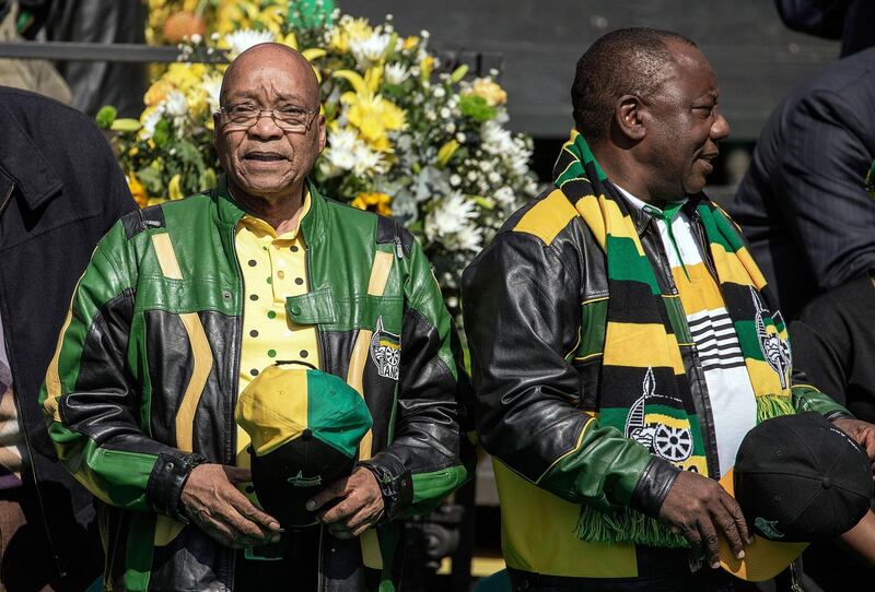 (FILES) In this file photo taken on July 31, 2016 South African ruling party African National Congress (ANC) president Jacob Zuma (L) and deputy Cyril Ramaphosa  arriving for the ANC closing rally campaign for the municipal elections at Ellis Park Stadium in Johannesburg. 
Cyril Ramaphosa's long and eventful career has taken him from trade union activist to multi-millionaire -- and now within a heartbeat of the South African presidency. / AFP PHOTO / GIANLUIGI GUERCIA