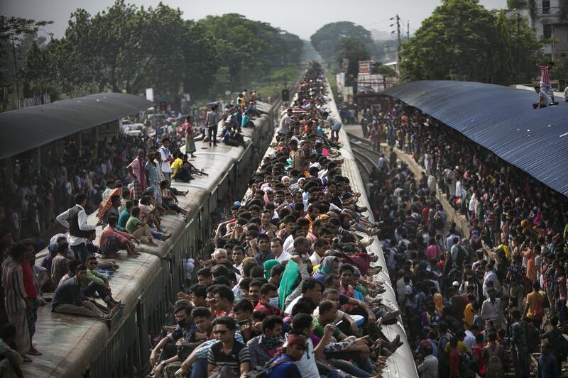 Bangladeshis travel by train to go home to their villages to celebrate Eid Al Adha. Allison Joyce / Getty Images