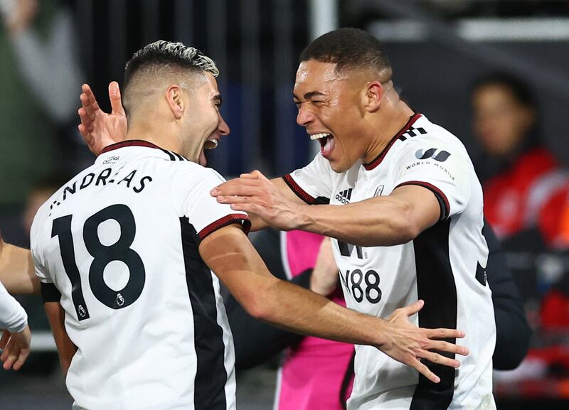 Fulham's Carlos Vinicius celebrates scoring their second goal with Andreas Pereira. Reuters