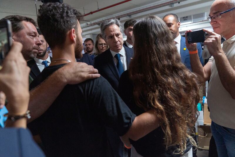 Mr Blinken speaks with survivors of a Hamas attack on a rave party, in Tel Aviv. AP