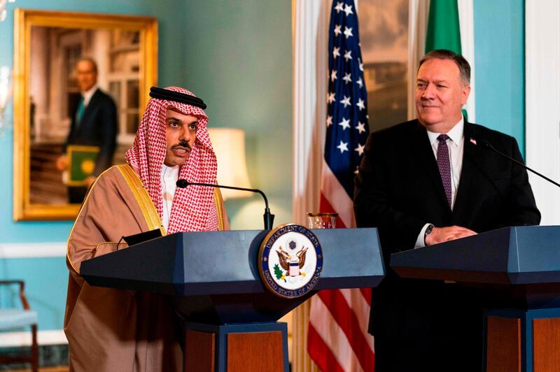 Secretary of State Mike Pompeo, right, listens to Saudi Minister of Foreign Affairs Prince Faisal bin Farhan Al Saud speaks during their meeting at the State Department, October 14, 2020, in Washington, DC.   / AFP / POOL / Manuel Balce CENATA
