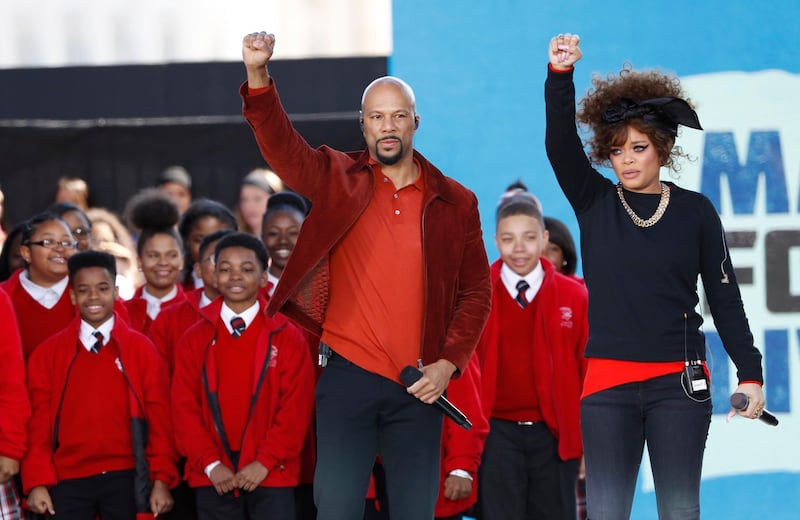 Common and Andra Day perform with the Cardinal Shehan Choir at a rally in Washington. Reuters