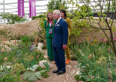 King Charles III at the Choose Love garden with the humanitarian aid movement's chief executive officer, Josie Naughton, and award-winning designer Jane Porter at Chelsea Flower Show. Getty 