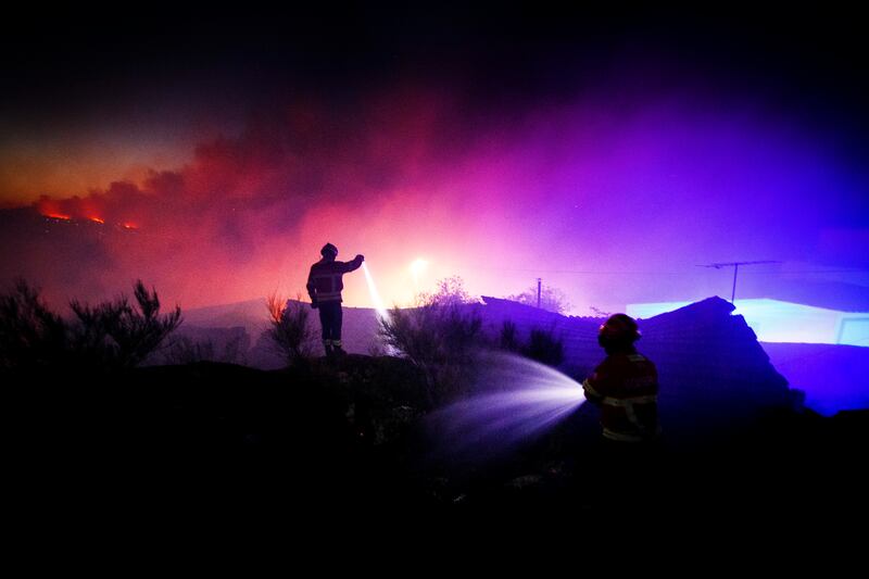 Firemen fight a forest blaze in Reboredo, Portugal. EPA