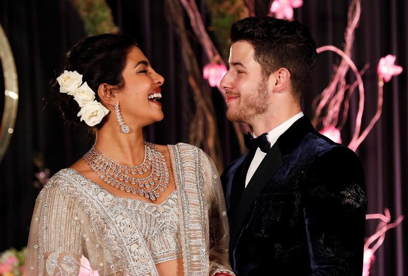 Newlyweds Priyanka Chopra, 36, and Nick Jonas, 26, pose for a photograph during a reception at a hotel in New Delhi on December 4, 2018. Photo: Reuters