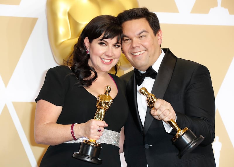 epa06581302 Kristen Anderson-Lopez (L) and Robert Lopez (R), winners of the Best Original Song Award for 'Coco', pose in the press room during the 90th annual Academy Awards ceremony at the Dolby Theatre in Hollywood, California, USA, 04 March 2018. The Oscars are presented for outstanding individual or collective efforts in 24 categories in filmmaking.  EPA-EFE/PAUL BUCK