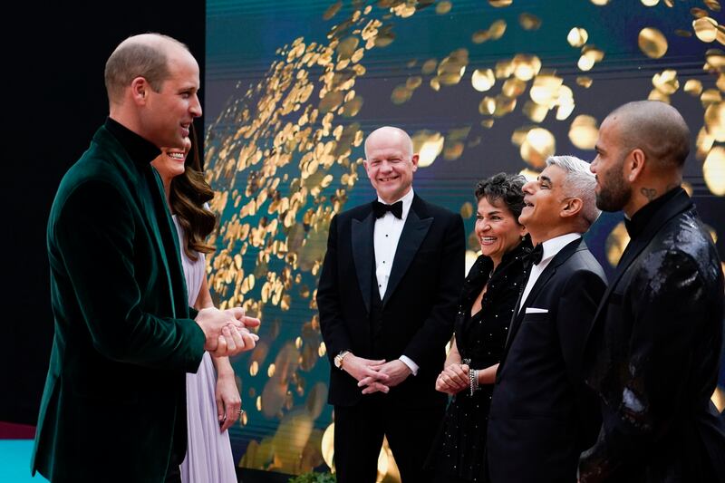 Prince William and Kate speak to guests. AP