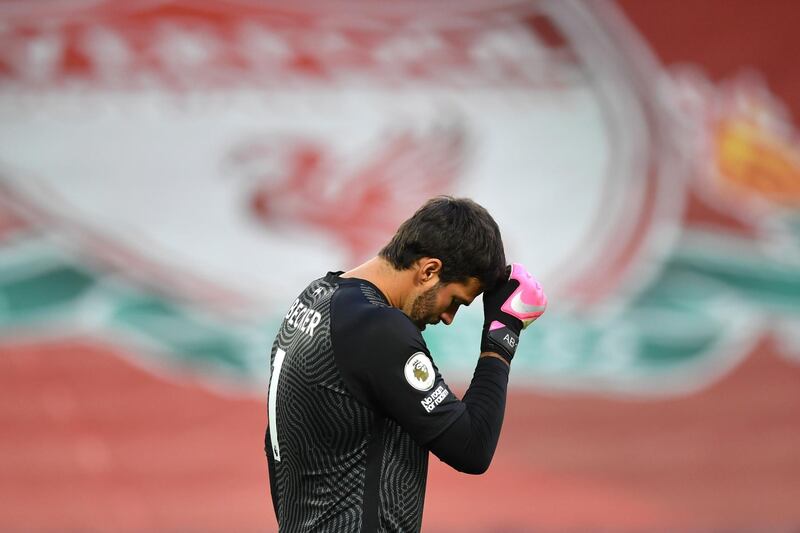 LIVERPOOL, ENGLAND - SEPTEMBER 12: Alisson Becker of Liverpool looks dejected after conceding a third goal during the Premier League match between Liverpool and Leeds United at Anfield on September 12, 2020 in Liverpool, England. (Photo by Paul Ellis - Pool/Getty Images)
