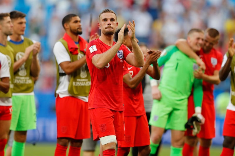 England's Jordan Henderson and his teammates celebrate victory of their team over Sweden during the quarterfinal match between Sweden and England at the 2018 soccer World Cup in the Samara Arena, in Samara, Russia, Saturday, July 7, 2018. (AP Photo/Frank Augstein)