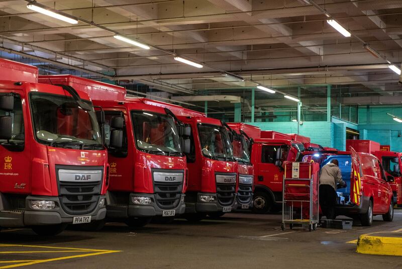 A lone postal worker loads a delivery van at the Royal Mail Whitechapel delivery office in London. Bloomberg