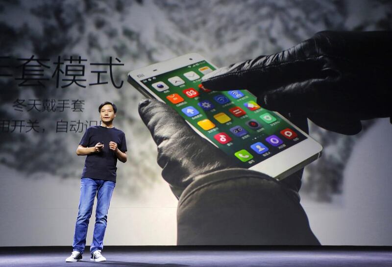 Lei Jun, founder and chief executive officer of China's mobile company Xiaomi, introduces the new features of Xiaomi Phone 4 at its launching ceremony in Beijing on July 22, 2014. Jason Lee / Reuters