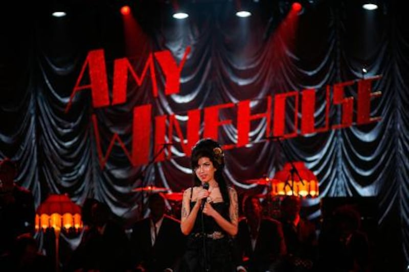 LONDON - FILE:  British singer Amy Winehouse performs at the Riverside Studios for the 50th Grammy Awards ceremony via video link on February 10, 2008 in London, England.  Winehouse has been found dead in her flat in North London on July 23, 2011.  (Photo by Peter Macdiarmid/Getty Images for NARAS) *** Local Caption ***  119660321.jpg