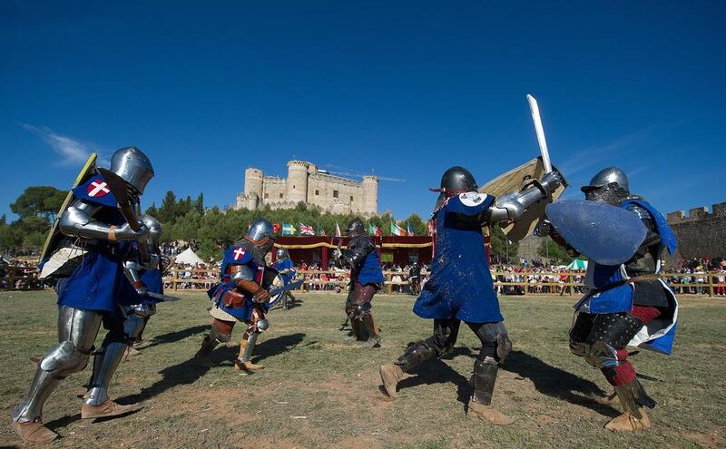 Knights of Denmark, left, and Quebec teams battle during the International Medieval Combat at Belmonte castle in Belmonte, Spain. Denis Doyle / Getty Images / May 2, 2014