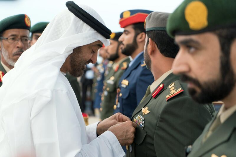 ABU DHABI, UNITED ARAB EMIRATES - November 12, 2018: HH Sheikh Mohamed bin Zayed Al Nahyan Crown Prince of Abu Dhabi Deputy Supreme Commander of the UAE Armed Forces (L), awards a members of the UAE Armed Forces with Medals of Bravery and Medals of Glory, during a Sea Palace barza.

( Rashed Al Mansoori / Ministry of Presidential Affairs )
---