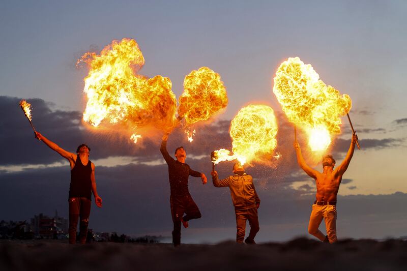 Fire breathers bring spectacle to Gaza city.