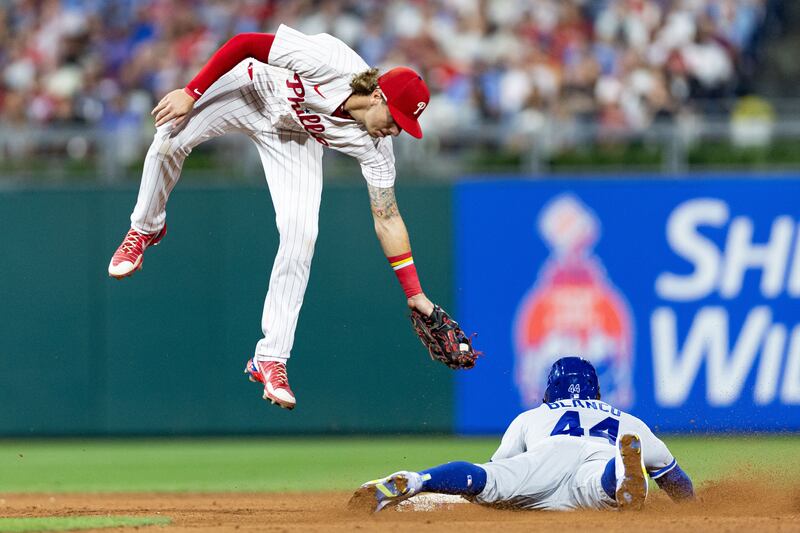 Kansas City Royals left fielder Dairon Blanco goes to ground to steal second base past Philadelphia Phillies' Bryson Stott during the sixth inning at Citizens Bank Park in Philadelphia, Pennsylvania.  Reuters