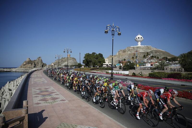 The pack is on the move February 23, 2014, during the sixth and last stage of the Tour of Oman cycling race. The 146.5-kilometre course runs from As Sifah to Matrah Corniche, Oman. Yoan Valat / EPA/