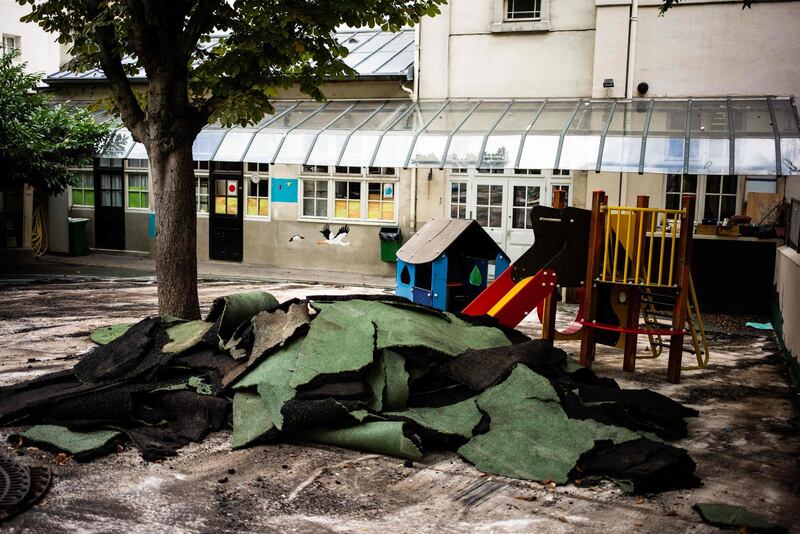 This picture taken on August 6, 2019 shows asphalt waste materials during a clean-up operation over lead poisoning fears at Saint Benoit school. AFP