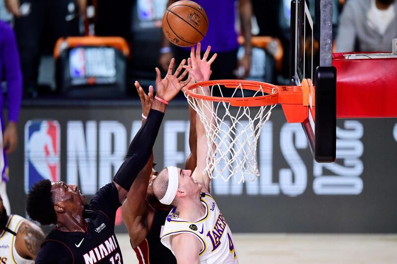 Lakers' Alex Caruso and Bam Adebayo of the Miami Heat. AFP