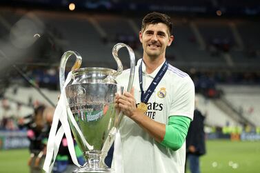 FILE PHOTO: Soccer Football - Champions League Final - Liverpool v Real Madrid - Stade de France, Saint-Denis near Paris, France - May 28, 2022 Real Madrid's Thibaut Courtois celebrates winning the champions league with the trophy REUTERS / Molly Darlington / File Photo