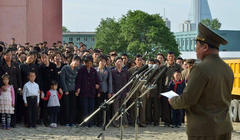 A North Korean official, right, apologises to the bereaved families of victims of a collapsed apartment building in Pyongyang, North Korea. A South Korean official said it was  believed to have caused considerable casualties, which could possibly mean hundreds of deaths. AP Photo