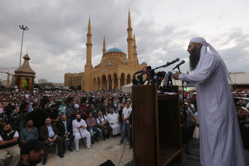 (FILES) This file photo taken on September 21, 2012 shows Lebanese Salafist figuer, Sheikh Ahmad al-Assir, adressing a crowd in downtown Beirut.
An Islamist cleric who was once Lebanon's most-wanted fugitive was sentenced to death on September 28, 2017 before a military court after being found guilty of terrorism, a judiciary source said. / AFP PHOTO / JOSEPH EID