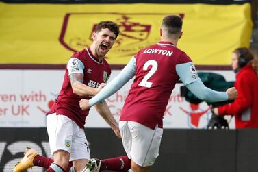 Burnley's Robbie Brady, left, celebrates scoring their first goal with Matthew Lowton during the English Premier League soccer match between Burnley and Everton at Turf Moor in Burnley, north west England, Saturday, Dec. 5, 2020. (Clive Brunskill//Pool via AP)