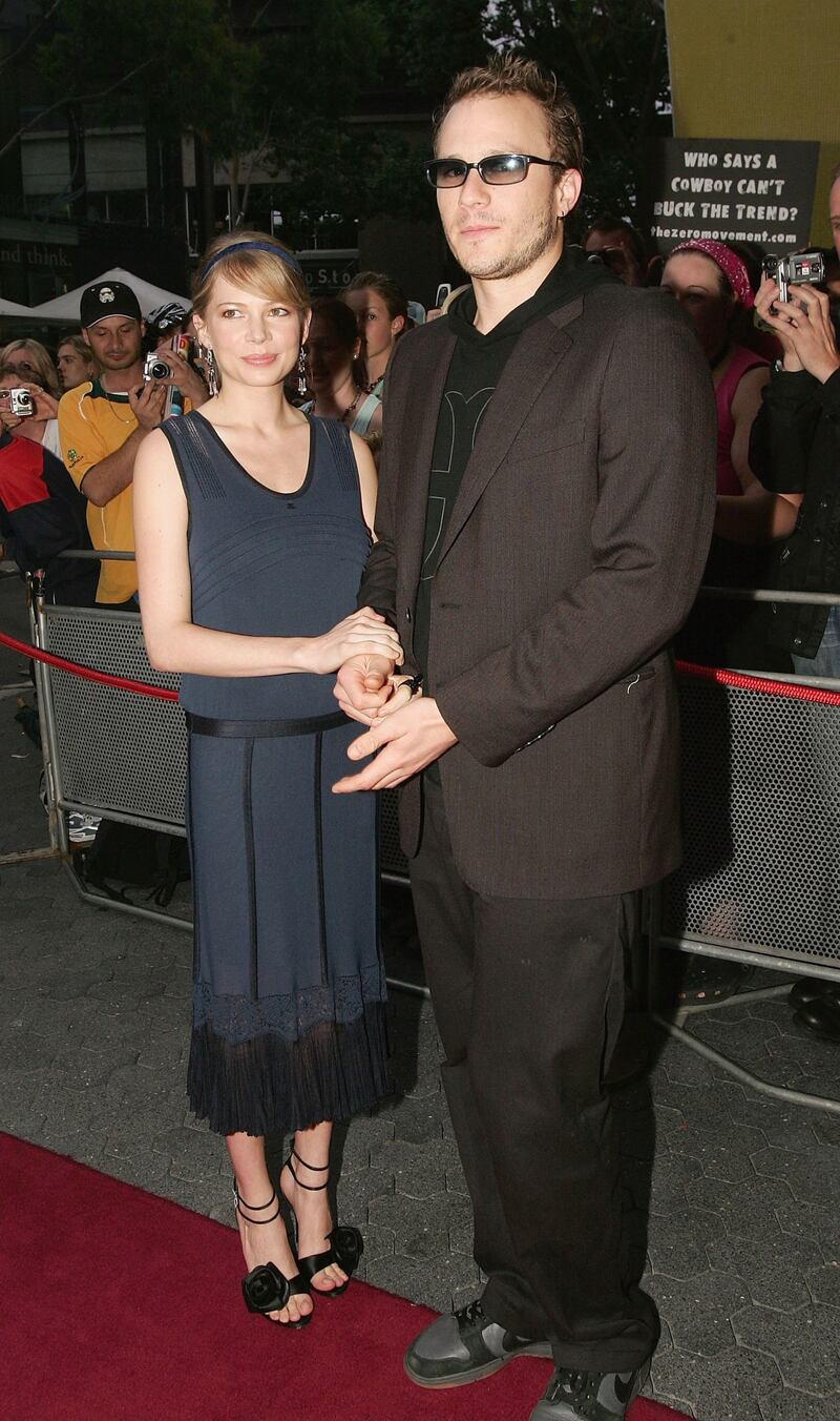 Michelle Williams, clad in a blue jersey 1920s-style dress, and Heath Ledger attend the red carpet premiere of 'Brokeback Mountain' in Sydney, Australia on January 13, 2006. Getty Images