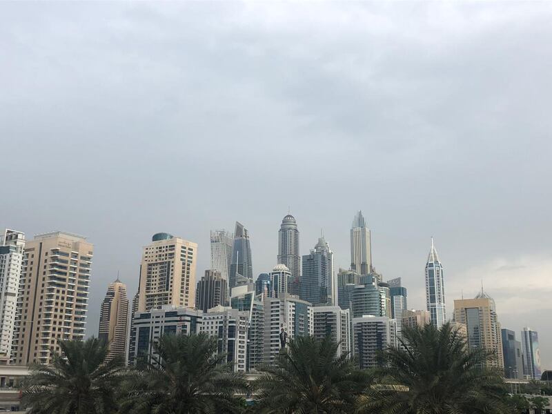 Dark clouds over Dubai Marina on Wednesday morning. Chris Whiteoak / The National