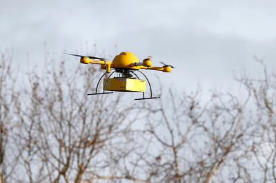 BONN, GERMANY - DECEMBER 09:  A quadcopter drone arrives with a small delivery at Deutsche Post headquarters on December 9, 2013 in Bonn, Germany. Deutsche Post is testing deliveries of medicine from a pharmacy in Bonn in an examination into the viability of using drones for deliveries of small packages over short distances. U.S. online retailer Amazon has also started its intention to explore the possibilities of using drones for deliveries.  (Photo by Andreas Rentz/Getty Images)