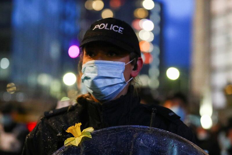 A police officer stands guard as demonstrators take part in a protest against a newly proposed policing bill, in Bristol. Reuters