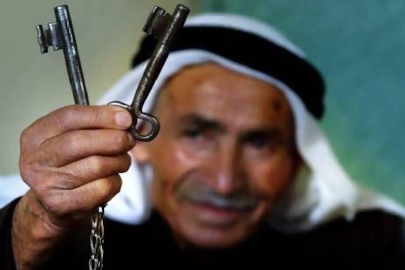 Palestinian Ahmed Elaian, 86, shows the keys of his home in Israel, abandoned during the 1948 Mideast war. Muhammed Mulheisen / AP Photo