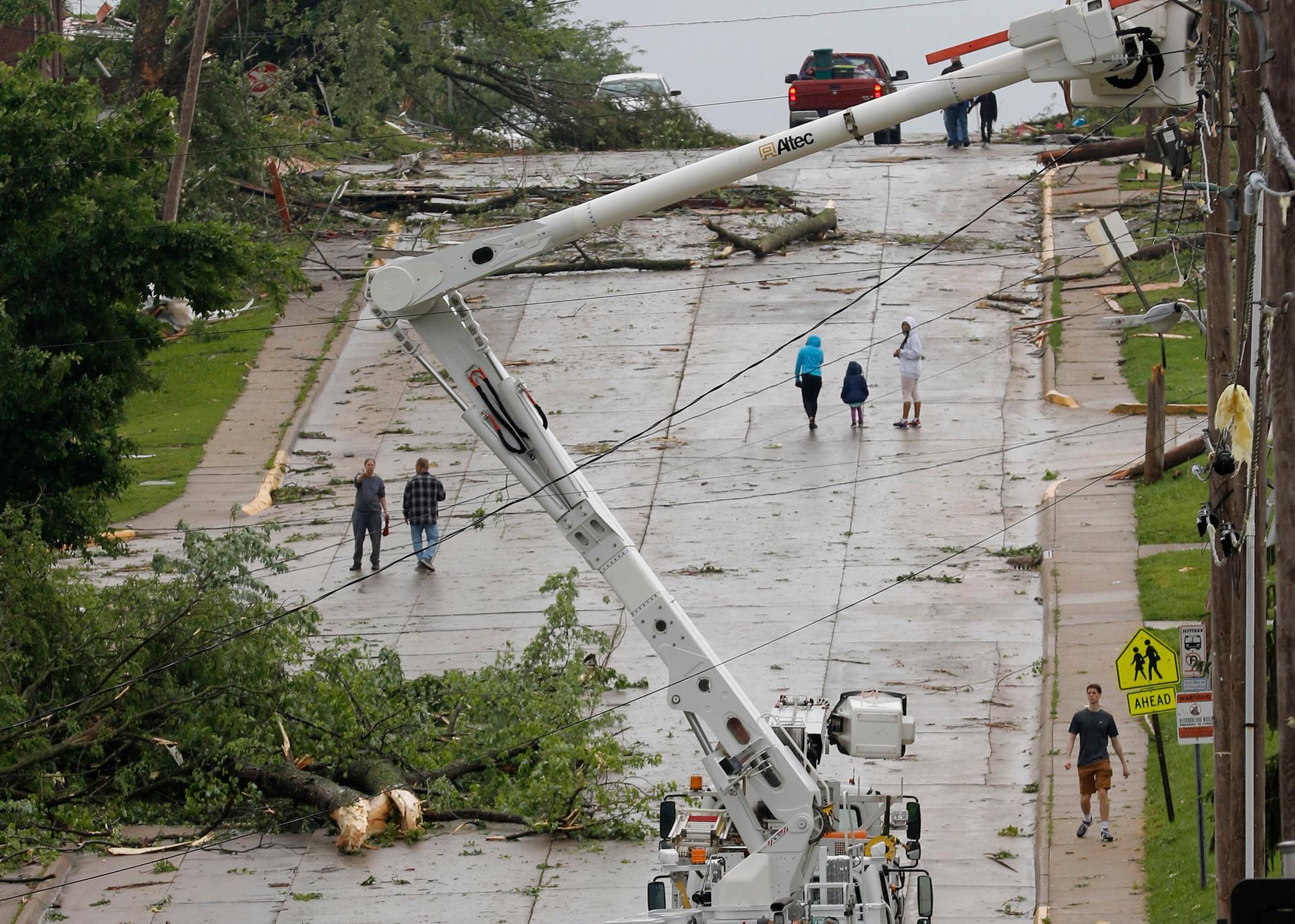 People walk up Dunklin Street in Jefferson City. Missourian via AP