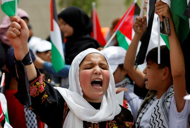 A Palestinian girl takes part in a Ramallah rally marking the 74th anniversary of the Nakba. Reuters