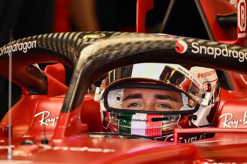 Ferrari's Monegasque driver Charles Leclerc sits in his car in the pits. AFP