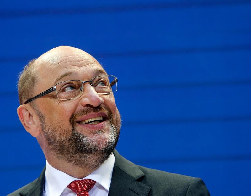 Social Democrat party Leader Martin Schulz looks up as he speaks during a board meeting at the SPD headquarters in Berlin, Germany, Monday, Sept. 25, 2017, the day after parliament election. (AP Photo/Michael Probst)