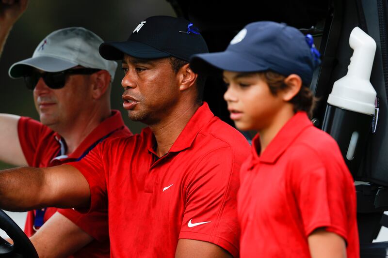 Tiger Woods alongside son Charlie during the second round of the PNC Championship tournament in Orlando. AP
